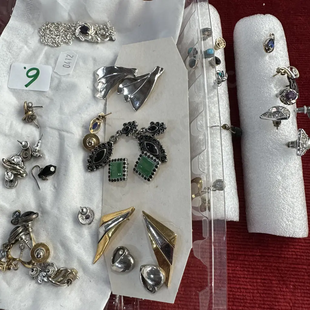 selection of ear studs plus tin of costume jewellery Image 1++