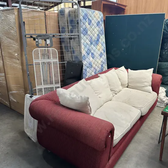single bed, roll away bed base, iron board, garage carpet offcut, lidded bin, sofa