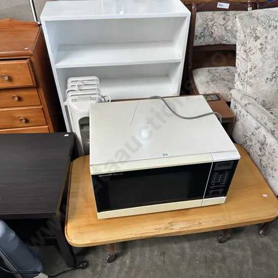 bookcase, coffee table, heaters and microwave