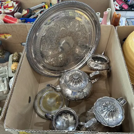 Box of silverware including lazy susan.