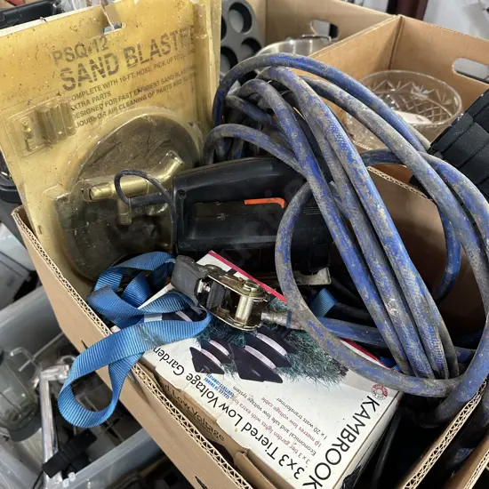 Box lot with sand blaster, jig saw, tie downs and garden lights etc.