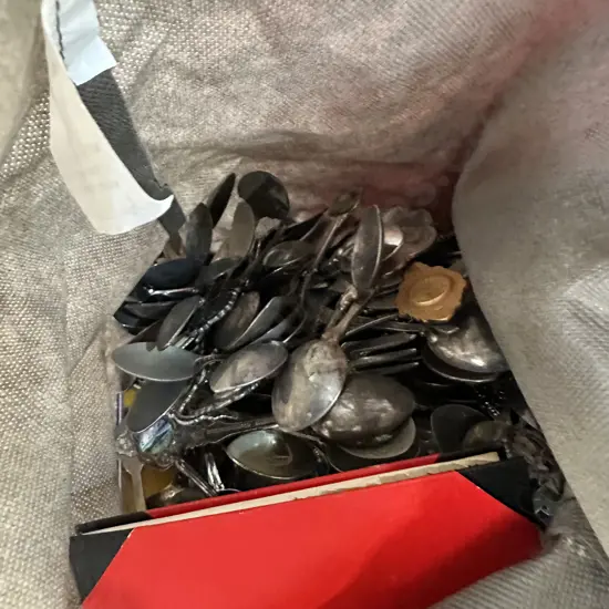 Large spoon collection including multiple wall display boards plus box of soft toys, suitcase and bags.