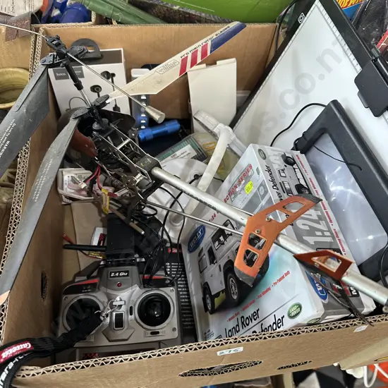 Box lot remote controlled helicopter, new wireless headphones and Land Rover Model etc.