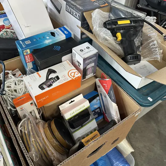 Box lot of assorted new products including modem routers, phone car mount and charger, weather strip, compressor and bin