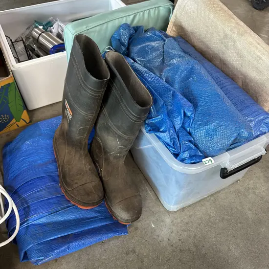 Bin of tarps, fadge and gumboots