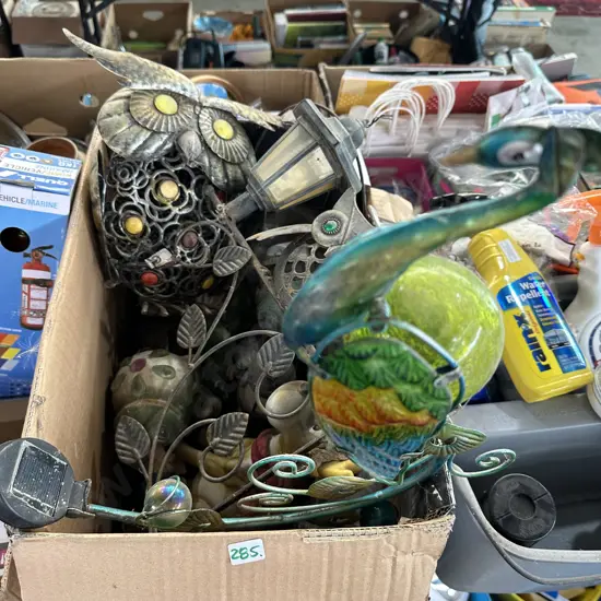 Box of metal art and solar lights etc.