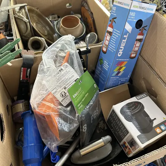 Box of new items including dry powder extinguisher, air bed pump etc.