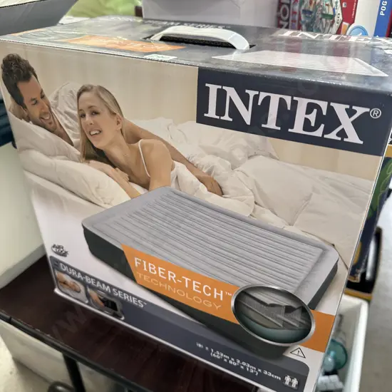 New Queen size air bed with built in Pump.