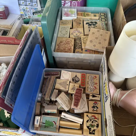 2 lidded containers of rubber stamps