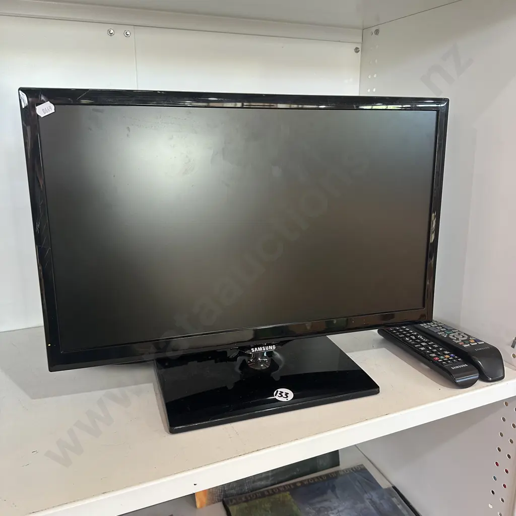 small TV and 2 remotes (no power cord) Image 1++