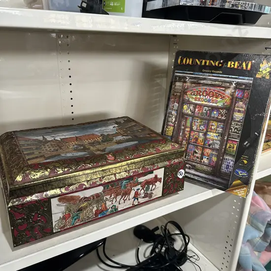 biscuit  tin and jigsaw puzzel