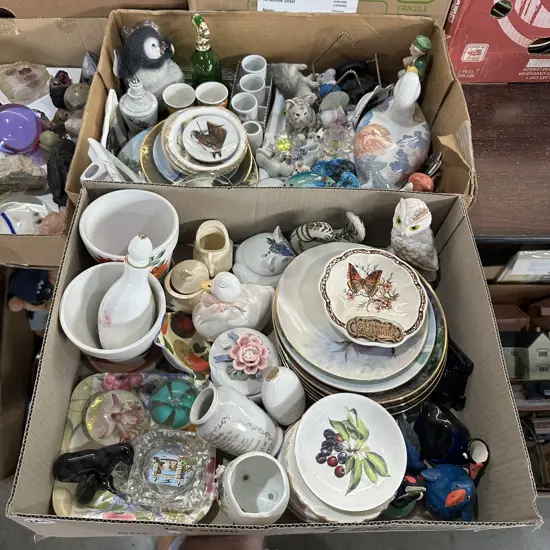 Two boxes of ornaments and collectables.