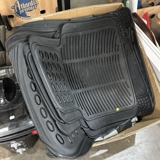 Large tarp and rubber car mats.