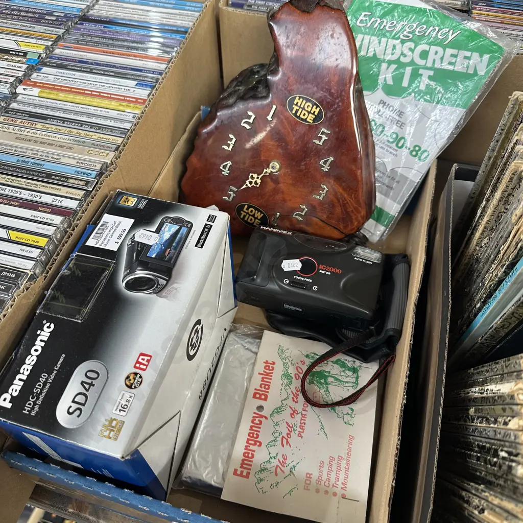 Panasonic Video camera, Hanimex camera, emergency items and swamp Kauri clock. Image 1++