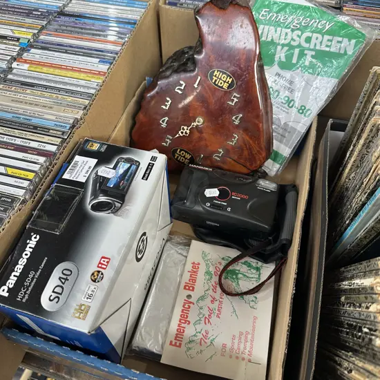 Panasonic Video camera, Hanimex camera, emergency items and swamp Kauri clock.