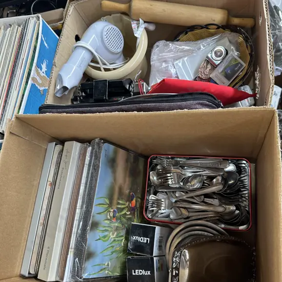 Two boxes cutlery, placemats, emergency radios etc.