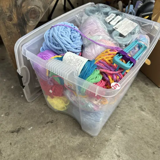 Lidded bin full of wool etc.