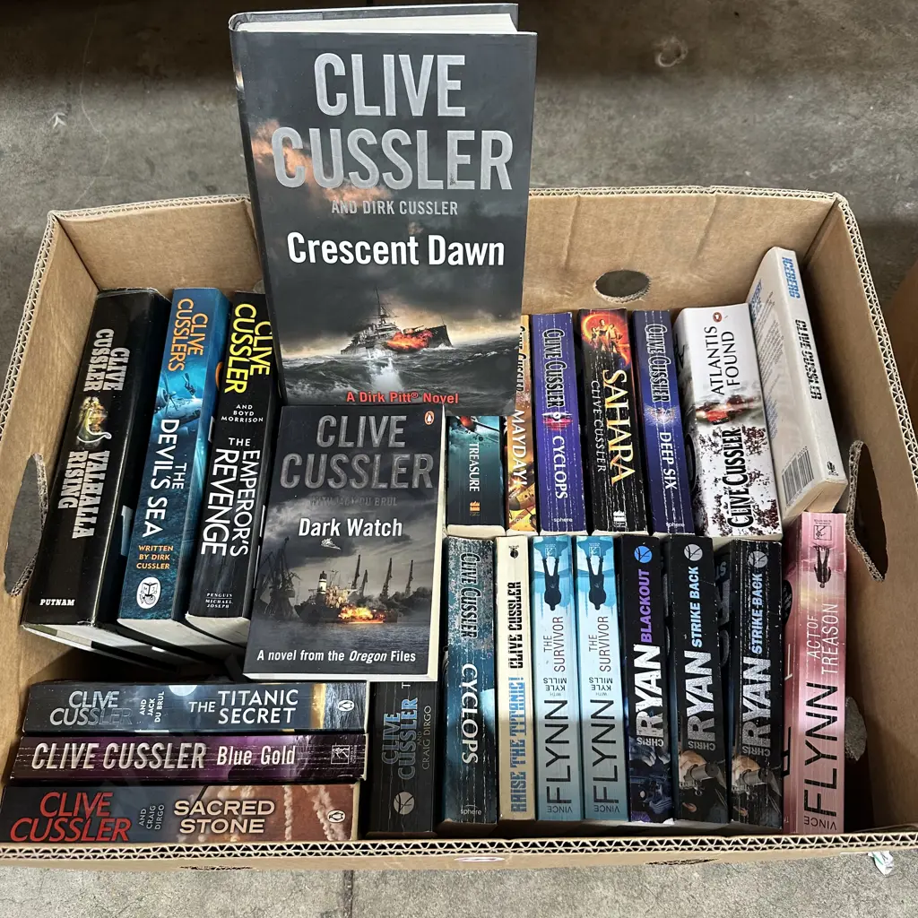 Box of good books including Clive Cussler etc. Image 1++