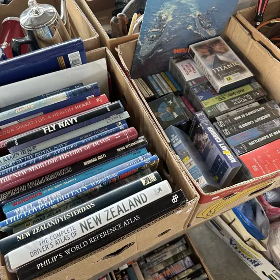 Two boxes of books ,videos and cassettes.