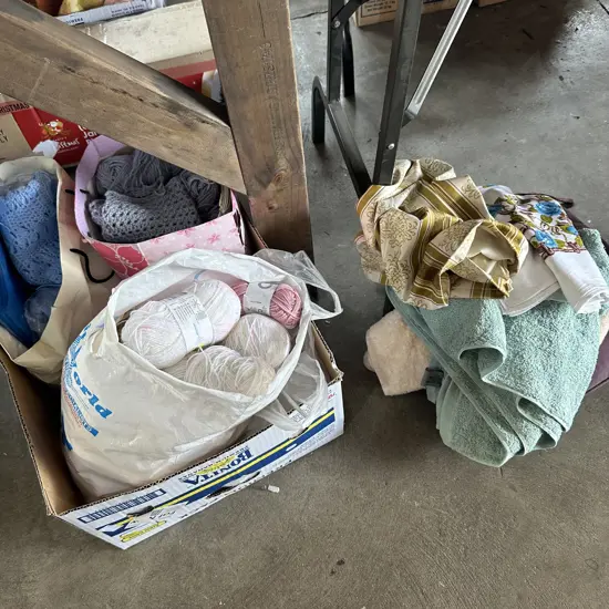 Box of wool, knitting, towels, seat pad etc.