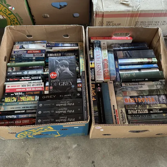 Two boxes of books including fifty shades of grey.