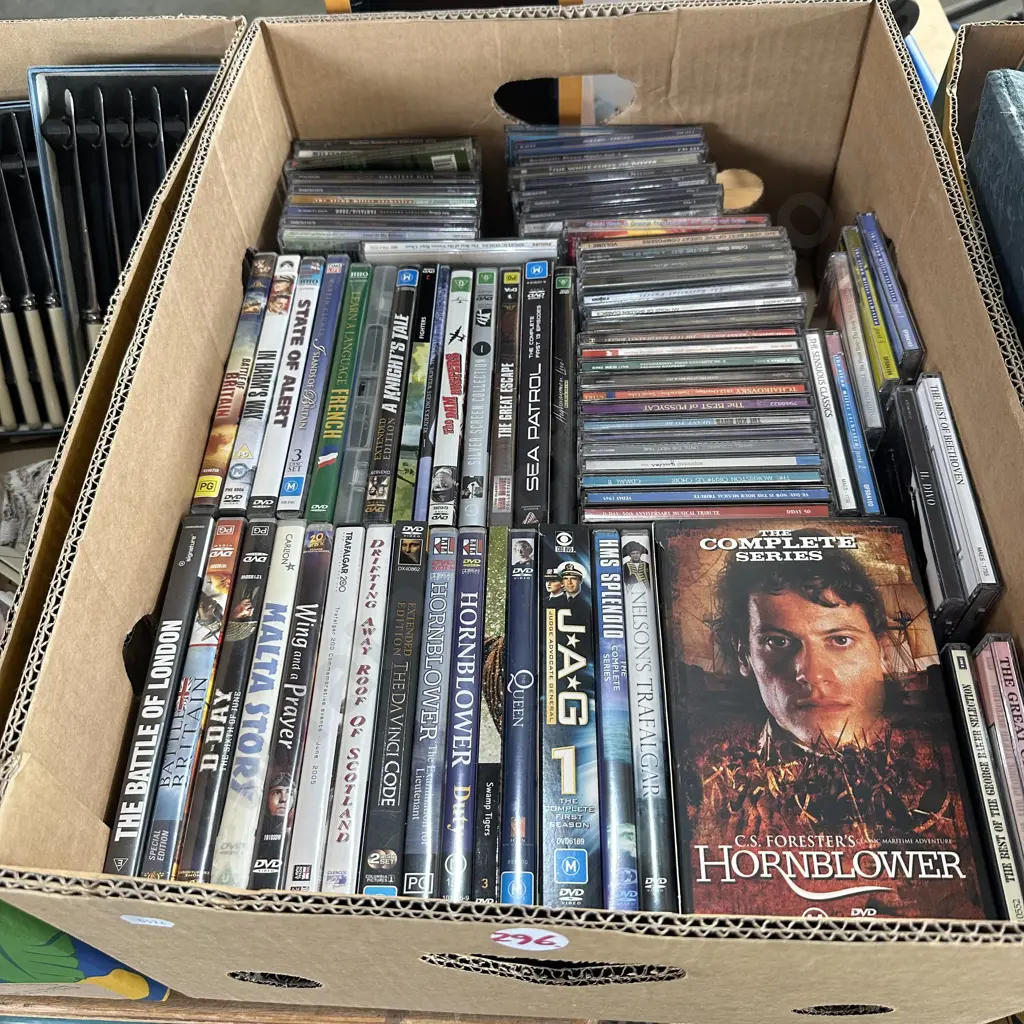 Box of DVDs and CDs and holder. Image 1++