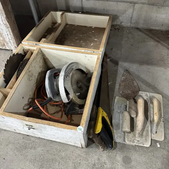 Skilsaw, spare blades and box, two hand saws and concrete tools.