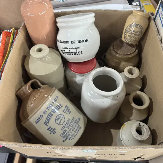 Collection of stone jars and pottery canisters