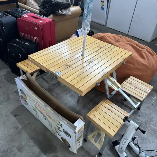 Wooden slated picnic tale and umbella