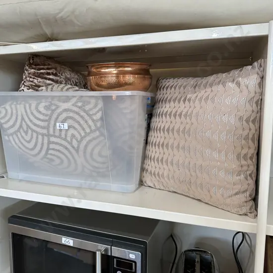 Bin of pillows and copper planter