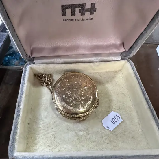 Locket stamped MTLOORE