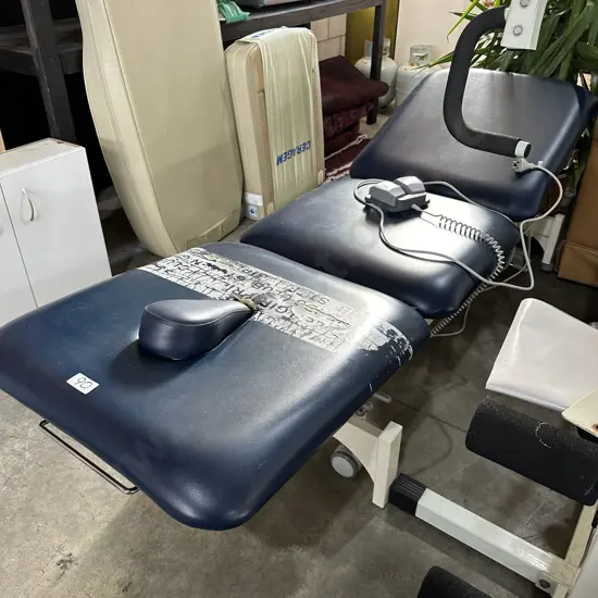 Elec massage table (some tears)