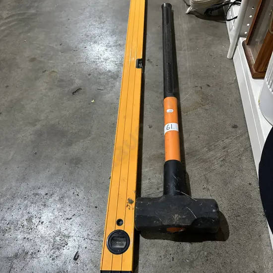 Level and sledge hammer