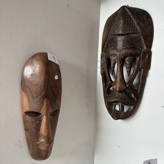 2 carved wooden masks