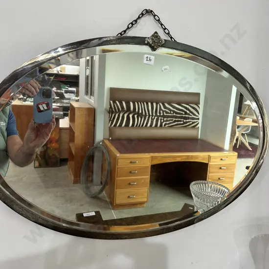 Bevel edge oval metal framed vintage mirror