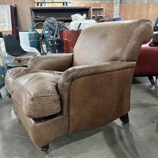 Distressed leather arm chair
