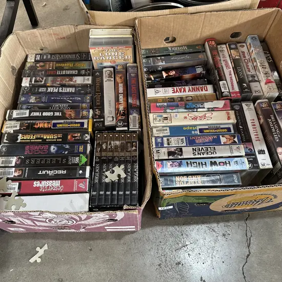 2 boxes DVDs and VHS tapes