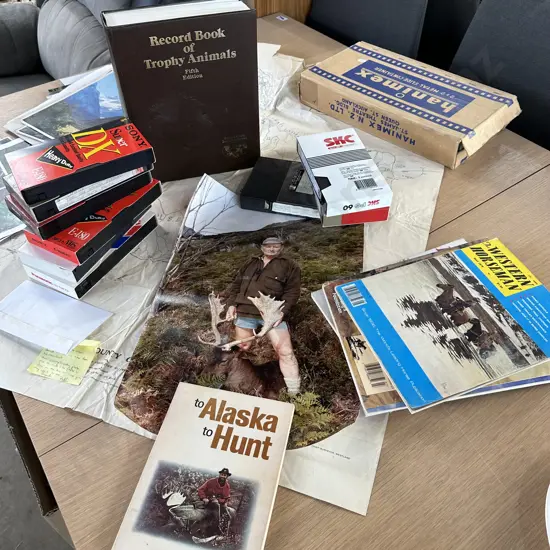 Hunting memorabilia inc VHS hunting trips and Record book of Trophy Animals