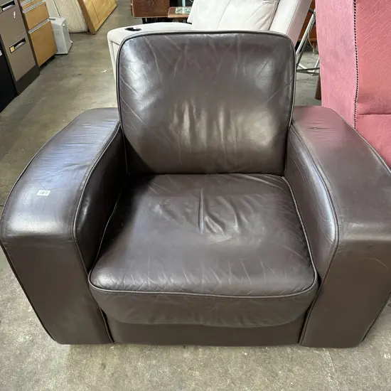 Leather lounge chair (has a tiny nic)
