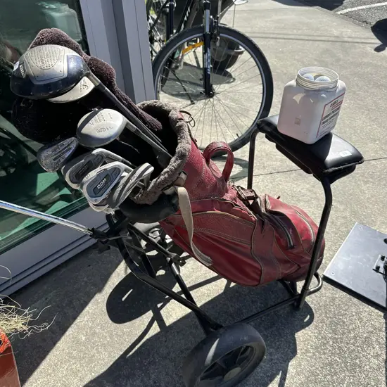 Golf clubs and trundler