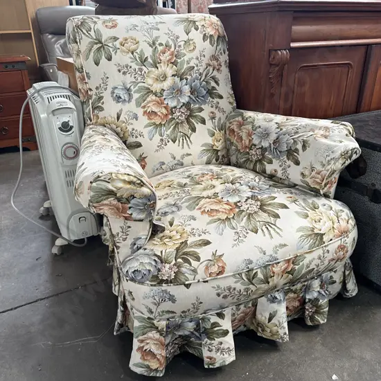 Very tidy Sanderson cover rolled arm chair on casters