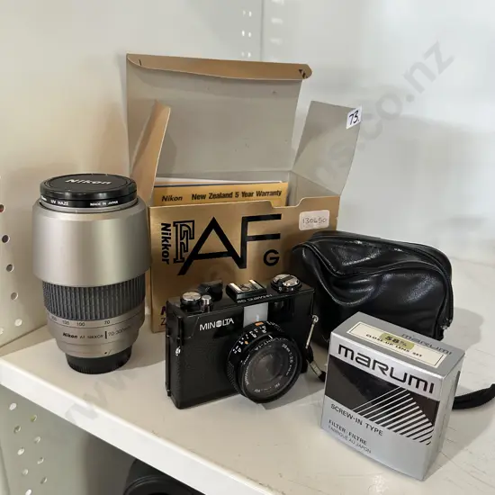 Nikon zoom lens and vintage Minolta camera