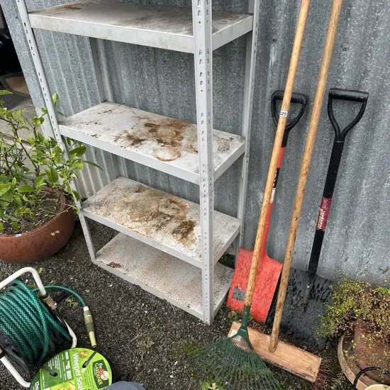 2 spades, broom and rake plus garage shelves