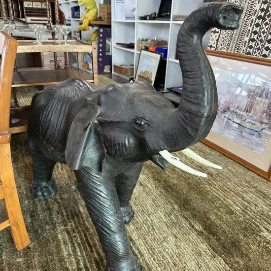 Baby elephant figure. Leather skin & plastic tusks