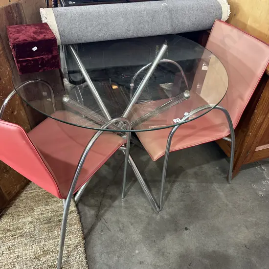 Glass top table 2 chairs (sun worn)