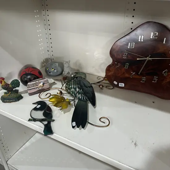 Shelf lot door stops, clock, wall art