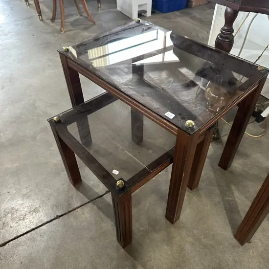 The 2 other matching glass side tables