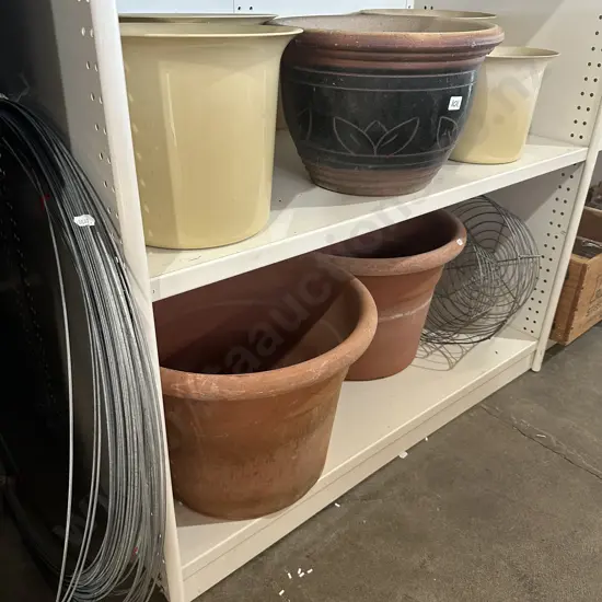2 shelves of planters and wire
