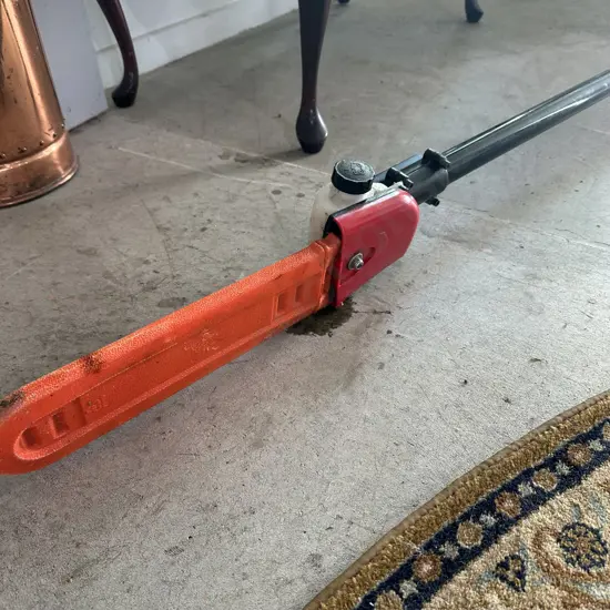 Pole petrol trimmer- working