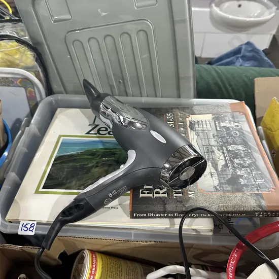 Bin of books plus hairdryer